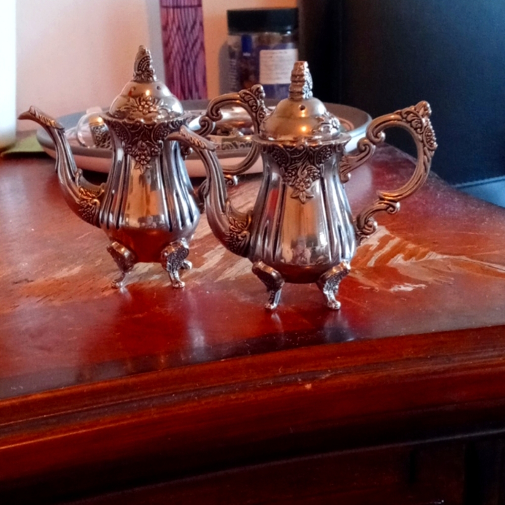 Silver plated salt and pepper shakers.